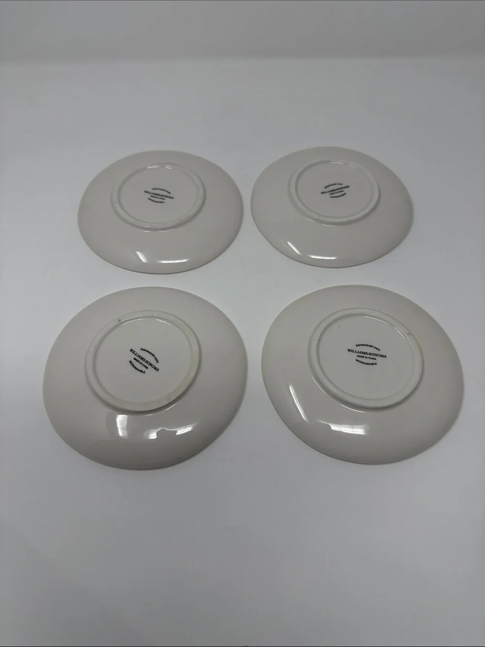Williams Sonoma Cream Ceramic Dinner Plates with Wine Bottle Motifs - Set of 4